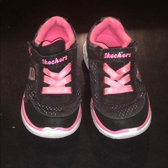 black and pink sketchers